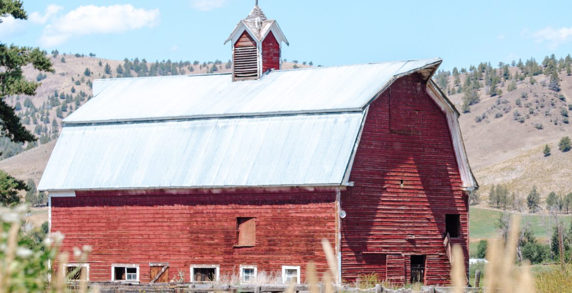 A large red barn near John Day, Oregon. You can view countless classic barns on the drive from John Day to Prairie City, Oregon.