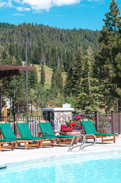 Active Recreation - Lake Cascade State Park & Tamarack Resort. A swimming pool and deck chairs at the Tamarack Resort Hotel.