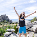 Explore the Best Hiking in Castle Rocks State Park Idaho. A young girl stands atop massive boulders inside the Castle Rocks State Park Idaho complex.